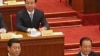 前排中共领导人出席北京召开的两会，从左至右：习近平，温家宝
