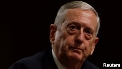 FILE - Retired U.S. Marine Corps General James Mattis, shown at his confirmation hearing before the Senate Armed Services Committee on Jan. 12, 2017, told Defense Department staff and service members worldwide that they represent "an America that remains a steady beacon of hope for all mankind."