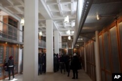 Officials walk around the main hall of the newly opened Saint Catherine library in South Sinai, Egypt, Dec. 16, 2017. The inauguration ceremony comes after three years of restoration work on the work on the eastern side of the library that houses the world’s second largest collection of early codices and manuscripts, outnumbered only by the Vatican Library.