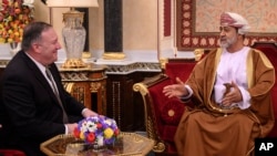 Oman's Sultan Haitham bin Tariq meets with US Secretary of State Mike Pompeo, left, at al-Alam palace in the capital Muscat, Feb. 21, 2020. 