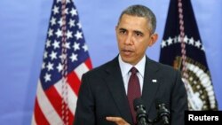 U.S. President Barack Obama answers a question about the situation in Ukraine in Washington, D.C. March 4, 2014.