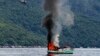 An unmanned Vietnamese fishing boat is blown up and sunk by the Indonesian navy, off the Natuna sea in Anambas, Kepulauan Riau province, Indonesia, Dec. 5, 2014.