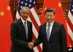 FILE - U.S. President Barack Obama, left, and Chinese President Xi Jinping shake hands at the West Lake State Guest House in Hangzhou, China, Sept. 3, 2016, on the sidelines of the G-20 summit.