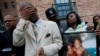 Mourners grieve at a vigil in honor of Edward and Edwin Bryant, twin brothers who at age 17 were shot and killed in Chicago, Illinois, Oct. 31, 2016. 