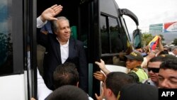 FILE - Organization of American States Secretary-General Luis Almagro waves to Venezuelan migrants in La Parada, Colombia, Sept. 14, 2018. Almagro is facing a probe of allegations he had a romantic relationship with a staff member that may have violated OAS ethics policies.