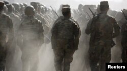 FILE - Afghan National Army (ANA) officers march during a training exercise at the Kabul Military Training Centre in Afghanistan, Oct. 7, 2015.