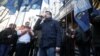 Activists hold a rally to demand a corruption investigation involving officials of Ukraine's defense procurement sector, near the Prosecutor General's Office in Kyiv, Ukraine, Feb. 27, 2019.