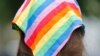 Democratic nominee for the House of Delegates 13th district seat, Danica Roem, wears a rainbow scarf as she greets voters while canvasses a neighborhood, June 21, 2017, in Manassas, Va. 