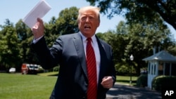 President Donald Trump speaks to reporters before departing for a trip to Iowa, on the South Lawn of White House, June 11, 2019.