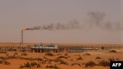 FILE - A Saudi Aramco oil installion known as "Pump 3" in the desert near the oil-rich area of Khouris, 160 km east of the Saudi capital Riyadh, is seen in a June 23, 2008, photo.