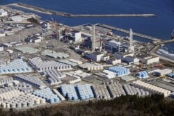 An aerial view shows the storage tanks for treated water at the tsunami-crippled Fukushima Daiichi nuclear power plant in Okuma town, Fukushima prefecture, Japan, Feb. 13, 2021, in this photo taken by Kyodo.