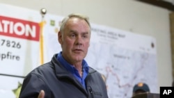 FILE - Ryan Zinke, Secretary of the Interior responds to a reporters question during a news conference after touring the fire ravaged town of Paradise, Calif., Nov. 14, 2018.