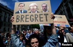 People hold banners during a 'March for Europe' demonstration against Britain's decision to leave the European Union, in central London, Britain, July 2, 2016.