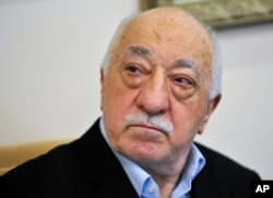 FILE -Islamic cleric Fethullah Gulen speaks to members of the media at his compound, in Saylorsburg, Pa.