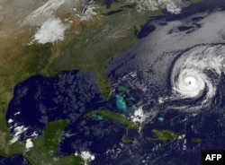This NOAA-NASA Goes East project satellite image shows Hurricane Nicole (R) at 1137UTC on Oct. 12, 2016. Nicole barreled toward Bermuda on Wednesday, just days after Matthew killed hundreds in the Caribbean, mostly in Haiti.