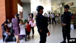 FILE - Indonesian Special Police patrol at Ngurah Rai Airport in Denpasar on Indonesia's resort island of Bali on Jan. 15, 2016.