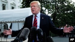 President Donald Trump speaks to reporters before leaving the White House in Washington, June 8, 2018, to attend the G-7 Summit in Charlevoix, Quebec, Canada. 