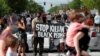 White US Police Officer Charged with Murder in Black Man's Death 