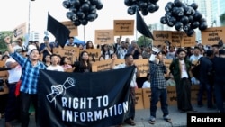 FILE - Myanmar press freedom advocates and youth activists hold a demonstration demanding the freedom of two jailed Reuters journalists Wa Lone and Kyaw Soe Oo in Yangon, Myanmar, Sept. 16, 2018. 