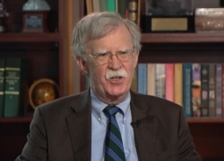 FILE - Former White House national security adviser John Bolton talks to VOA, June 24, 2020.