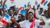 FILE - Supporters of the ruling Rwandan Patriotic Front (RPF) cheer during a rally by Rwandan President Paul Kagame in Nyanza, Rwanda, July 14, 2017.