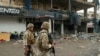 Lebanese army soldiers secure the area outside a building that was targeted in an Israeli airstrike in Beirut's southern suburbs on November 2, 2024, amid the ongoing war between Israel and Hezbollah. Lebanon's health ministry said 11 people were wounded on November 2 in an Israeli strike on Hezbollah's south Beirut stronghold, which has been hard hit by the Israel-Hezbollah war. 