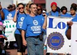 United Auto Workers union members march in the Labor Day Parade in Detroit, Michigan, Sept. 2, 2019.