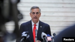 FILE - Georgia Secretary of State Brad Raffensperger gives an update on the state of the election and ballot count during a news conference at the State Capitol in Atlanta, Ga., Nov. 6, 2020.