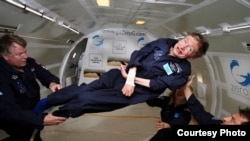 FILE - Stephen Hawking, almost totally paralyzed since 1970 by ALS, enjoys a few moments of weightlessness during a flight aboard Zero Gravity Corp.’s modified Boeing 727. (Jim Campbell, Aero-News Network)