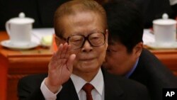 Former Chinese President Jiang Zemin gestures during the opening session of the 18th Communist Party Congress in Beijing, China, Nov. 8, 2012. 