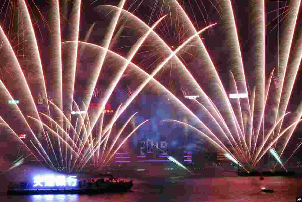 Fireworks explode over Victoria Harbor during New Year&#39;s Eve to celebrate the start of year 2019 in Hong Kong, Jan. 1, 2019.