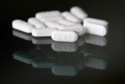 This Monday, April 6, 2020 file photo shows an arrangement of hydroxychloroquine pills in Las Vegas.