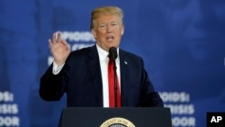 FILE - President Donald Trump speaks about his plan to combat opioid drug addiction at Manchester Community College, March 19, 2018, in Manchester, New Hampshire.