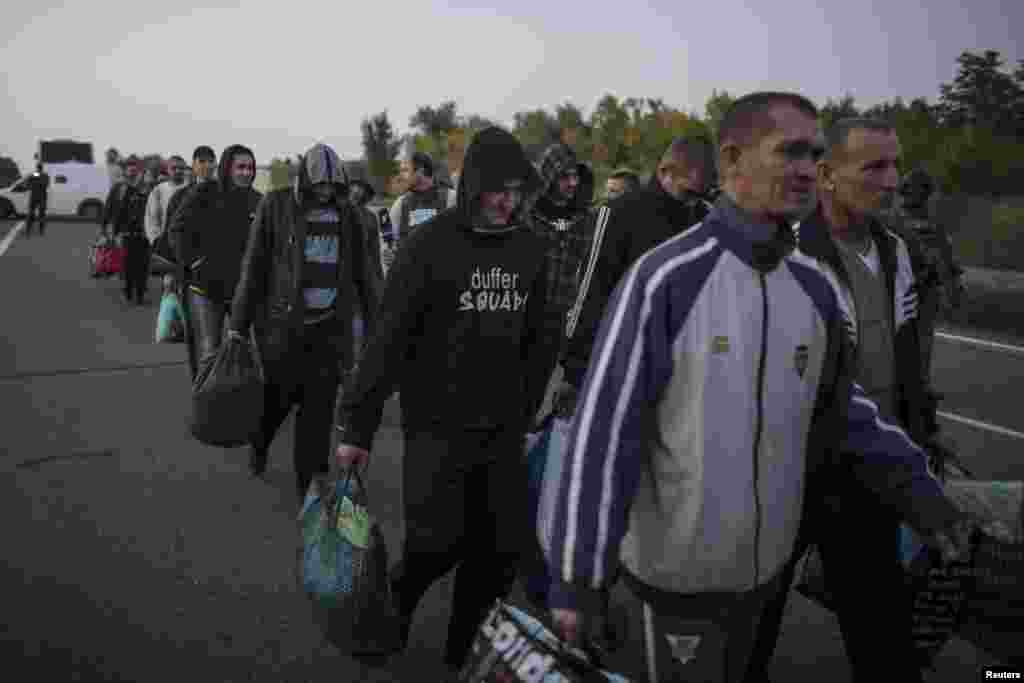 Pro-Russian POWs wait to be exchanged, north of Donetsk, eastern Ukraine, Sept. 28, 2014.
