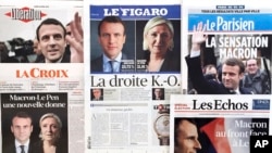 Le candidat centriste Emmanuel Macron et sa concurrente d'extrême droite Marine Le Pen sont sur la « Une » journaux du français à Paris, France, 24 avril 2017. 