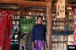 Lmam Pjanh, a Kachork ethnic village, stands inside her simple wooden house in the northeast Cambodia’s Rattanakiri province. (Sun Narin/VOA Khmer)