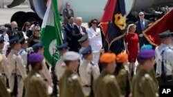 US President Donald Trump, background centre left and first lady Melania Trump participate in an arrival ceremony at Ben Gurion International Airport, May 22, 2017.