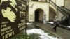 FILE - A tourist walks out from the Izaak Synagogue in the Krakow district of Kazimierz, Poland, once a Jewish part of the town.