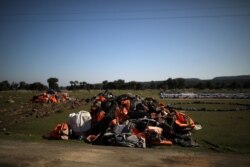 A pile of life jackets is seen in the spot where the government planned to build a new migrant detention center, in the area of Karava on the island of Lesbos, Greece, Feb. 17, 2020.