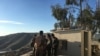 Iraqi Kurdish Peshmerga soldiers huddle around Maj. Gen. Sirwan Barzani in Makhmour, Iraq. Makhmour is expected to serve as a staging point for Iraqi and Peshmerga forces in the advance against IS-controlled Mosul, March 8, 2016. (S. Behn/VOA)