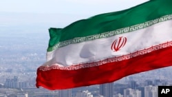 FILE - Iran's national flag waves in Tehran, Iran, March 31, 2020.