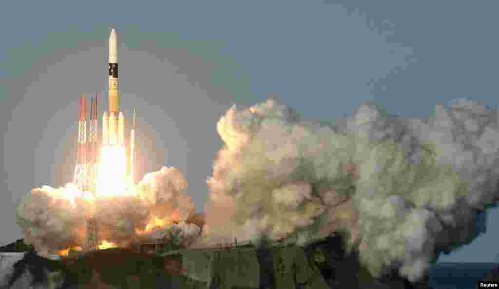 A H-IIA rocket, carrying Telesat&#39;s broadcast and telecommunication satellite, lifts off from the launching pad at Tanegashima Space Center on the Japanese southwestern island of Tanegashima, in this photo taken by Kyodo.