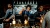 FILE - Starbucks employees prepare coffee in the lobby of the company's annual shareholders meeting in Seattle, Washington. That boss-to-worker pay ratio is slightly lower than it has been in the past few years, but is still "light years" higher than the 20-to-1 gap between workers and bosses in 1965, or the 59-to-1 difference that was measured in 1989.