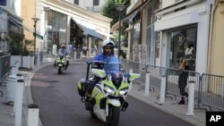Police officers on motorcycles patrol on deserted streets ahead of the G-7 summit in Biarritz, France, Aug. 23, 2019.
