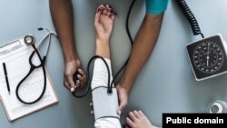 Nurse taking blood pressure
