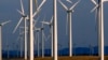 FILE - A wind turbine farm owned by PacifiCorp near Glenrock, Wyoming, cranks out electricity, May 6, 2013.