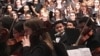 Panh Panhlauv, center, was chosen to play in this year’s High School Choir Festival for the first time as part of the D.C. Youth Orchestra Program.