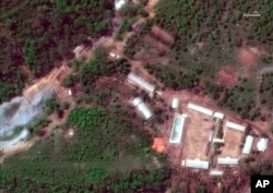 FILE - This, May 23, 2018, satellite file image provided by DigitalGlobe, shows the Punggye-ri nuclear test site in North Korea. Foreign journalists reported that month that tunnels in the Punggye-ri site had been destroyed by North Korea in a bid to ease regional tensions.