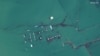 FILE - A satellite image shows flooded homes near the Uzbekistan-Kazakhstan border following the collapse of the Sardoba dam in Uzbekistan, May 3, 2020. 