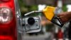 A worker fills a tank with subsidized fuel at a fuel station in Jakarta, April 18, 2013. 
